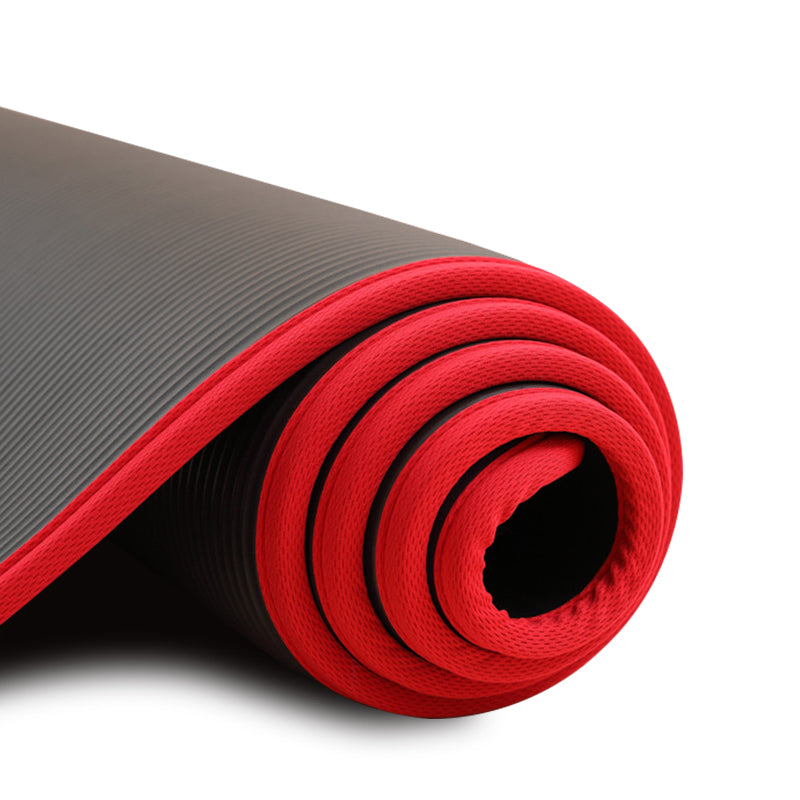 Rolled black 10mm yoga mat with red edge binding
