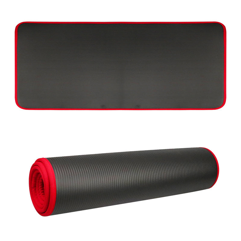 Black 10mm yoga mat with red trim, laid flat and rolled