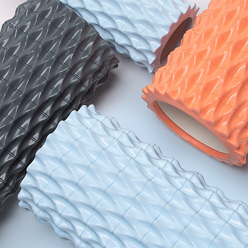 Wave-textured foam rollers in gray, blue and orange